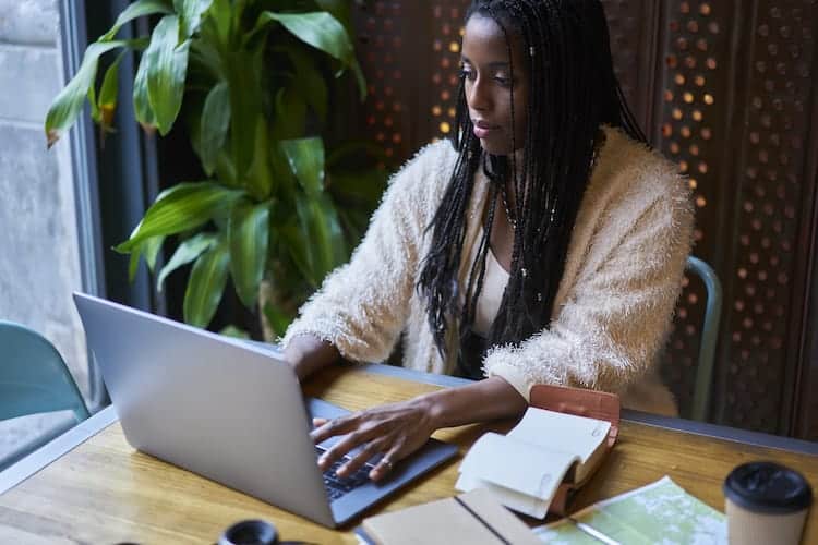 African American woman updating her resume